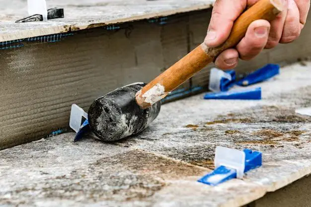 What tool removes tile from concrete