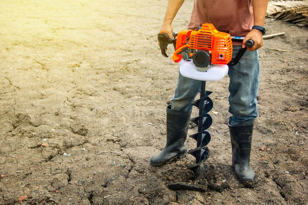 How deep can a hand held auger go