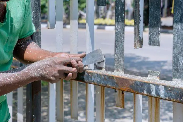 Do I need to sand a metal fence before painting