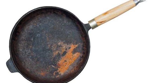 How do you keep cast iron from rusting in storage?