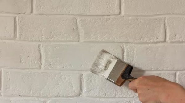 How do you paint a faux brick wall?