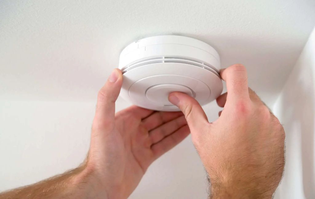 How do I permanently disable my hardwired smoke detector